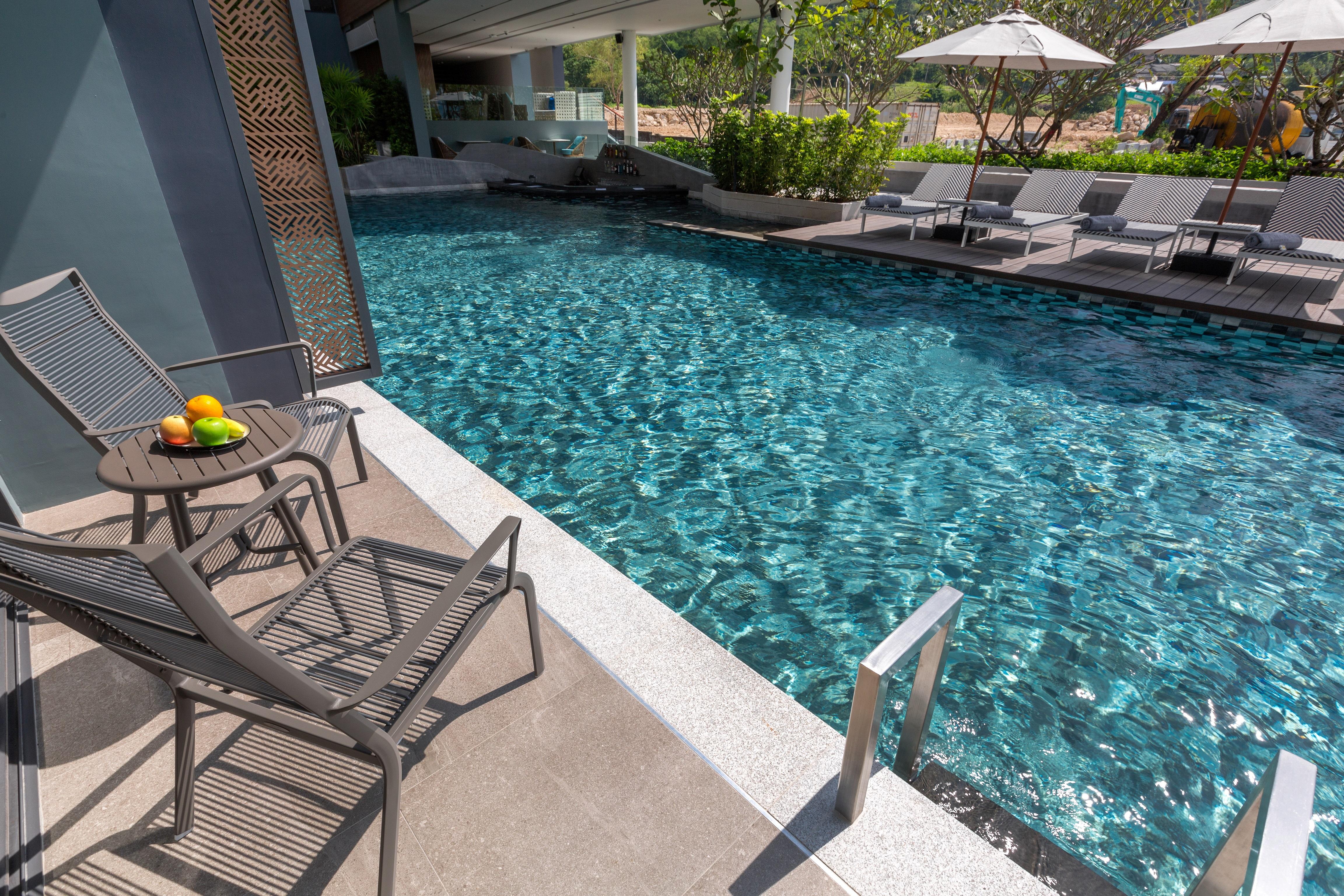 The Nature Phuket - Sha Extra Plus Экстерьер фото The swimming pool at the hotel